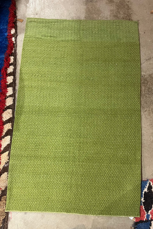 Solid green rug